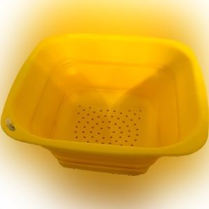 Progressive mini 3 cup collapsible colander; snap on bottom catches drips yellow